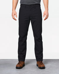 Chino Pants e.s.e:pic in black worn by a model, front view