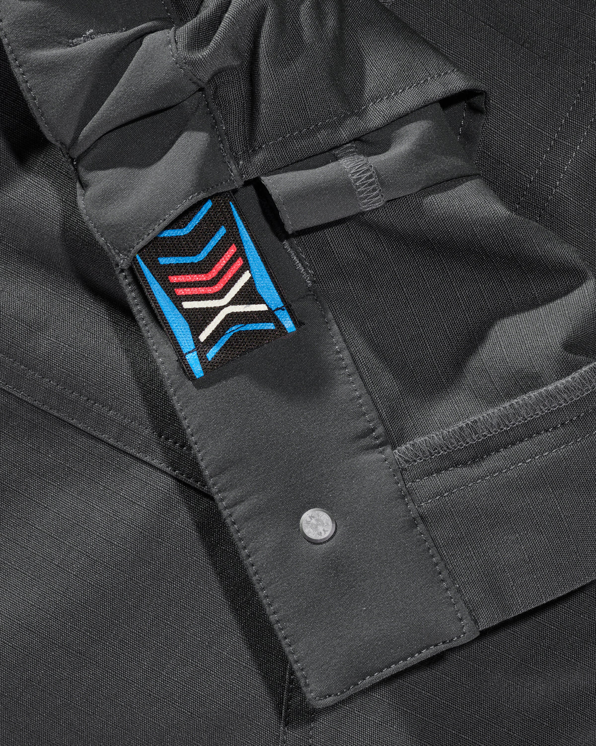 Close-up of reinforced fabric and seams on Ripstop Cargo Work Pants e.s.e:pic in carbon gray
