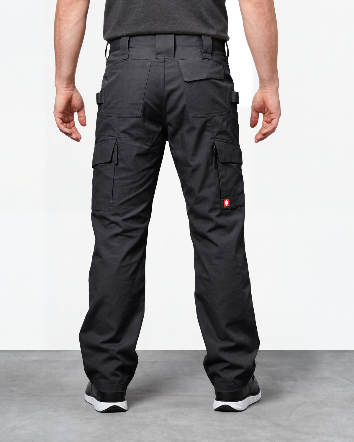 Double Front Ripstop Cargo Work Pants e.s.e:pic in black worn by a model, rear view