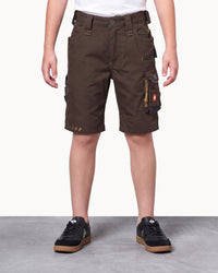 A person wearing dark brown cargo shorts with multiple utility pockets, paired with black sneakers, shown from the waist down against a light studio background.