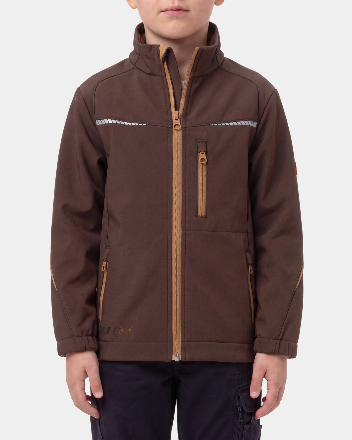A child wearing a brown softshell jacket with tan zipper details and reflective chest stripes, shown against a light gray studio background.
