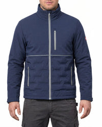 A man wearing a navy blue Quiksilver zip-up puffer jacket with silver zippers and a high collar, paired with dark gray cargo pants, against a plain white background.
