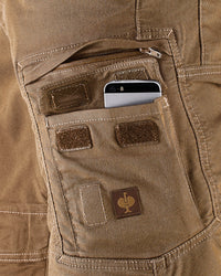 Close-up detail of Engelbert Strauss e.s. vintage cargo shorts in sepia, focusing on the utility pocket area, seams, and reinforced workwear construction.