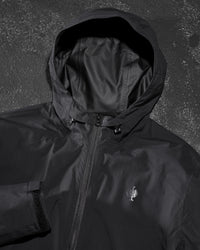 STRAUSS women's e.s.trail light pack windbreaker in black paired with workwear