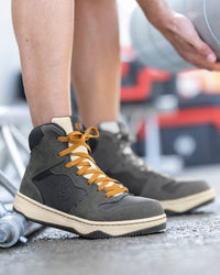 STRAUSS Eindhoven 6-inch Steel Toe Work Boot in Carbon gray and Nero blue shown on rough jobsite ground