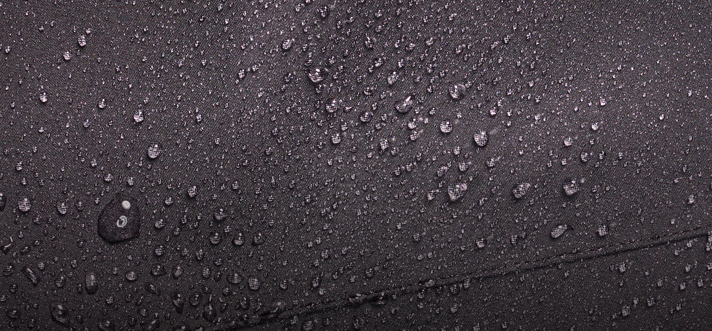 Close-up of water droplets on a black surface