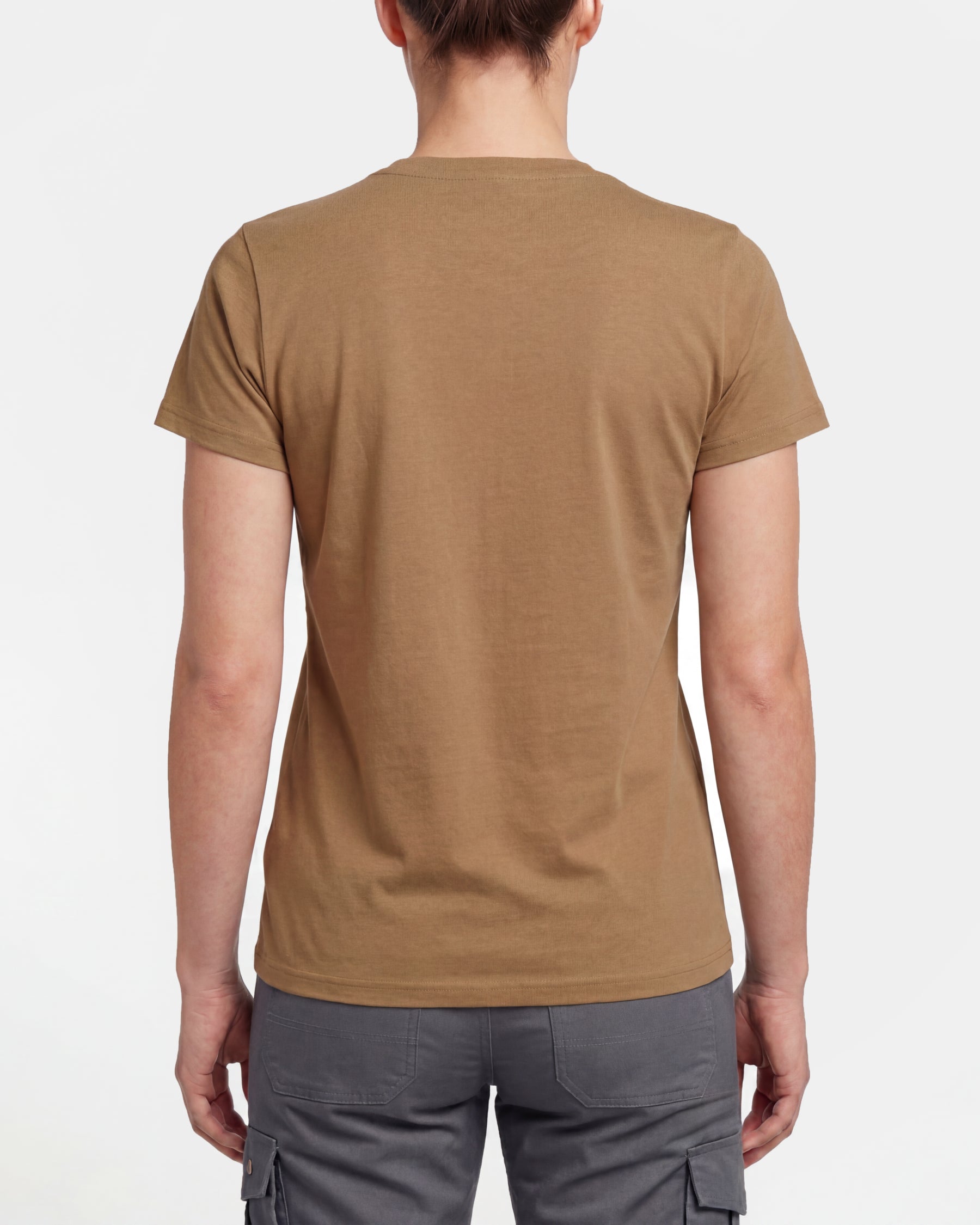 A woman wears the Women's STRAUSS Artwork T-Shirt e.s.e:pic in almond brown with work pants and work boots, showing the shirt fit