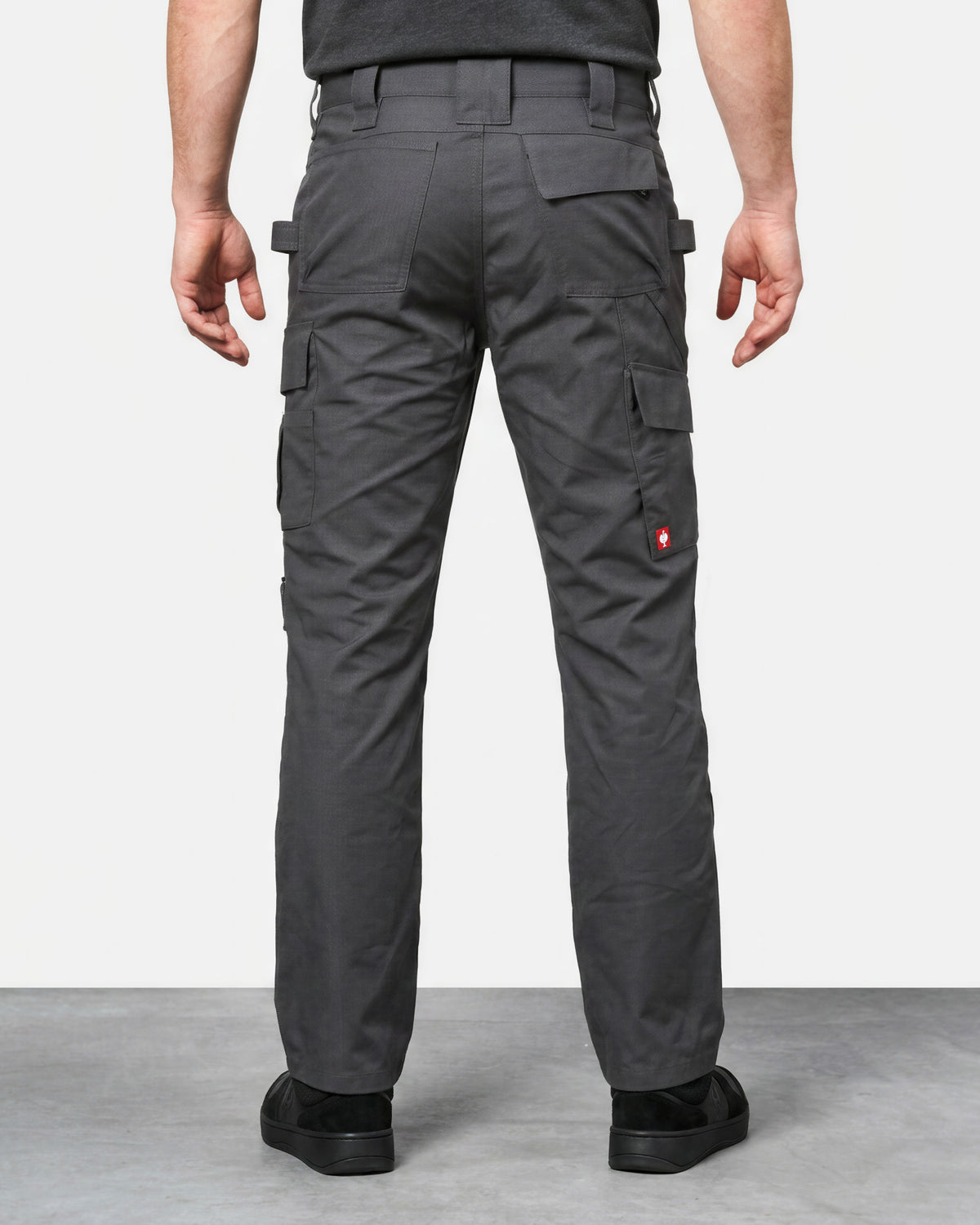 Ripstop Cargo Work Pants e.s.e:pic in carbon gray worn by a model, rear view