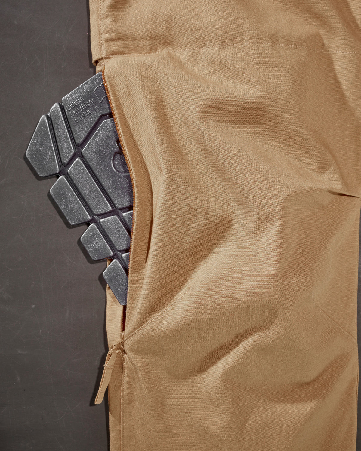 Close-up of knee pad pocket details on Women's Ripstop Cargo Work Pants e.s.e:pic in almond brown