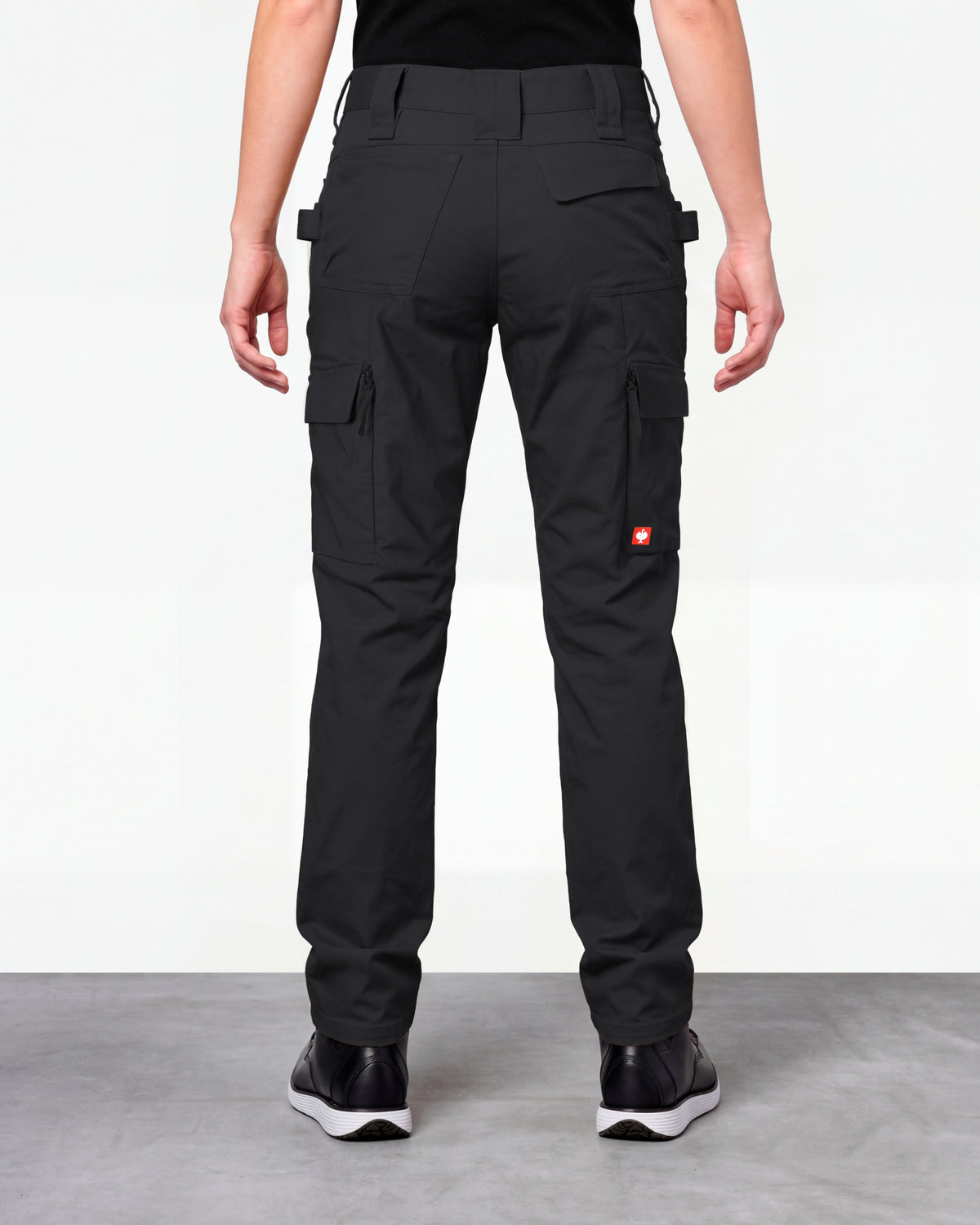 Women's Double Front Ripstop Cargo Work Pants e.s.e:pic in black worn by a model, rear view