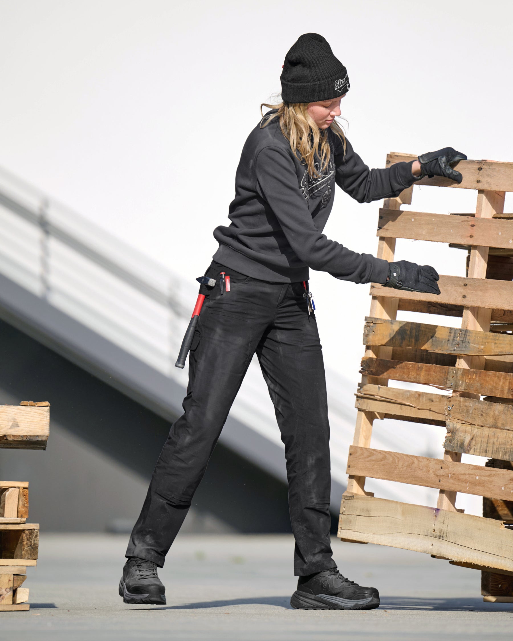 Women's Double Front Ripstop Cargo Work Pants e.s.e:pic in black in use, showing fit and movement