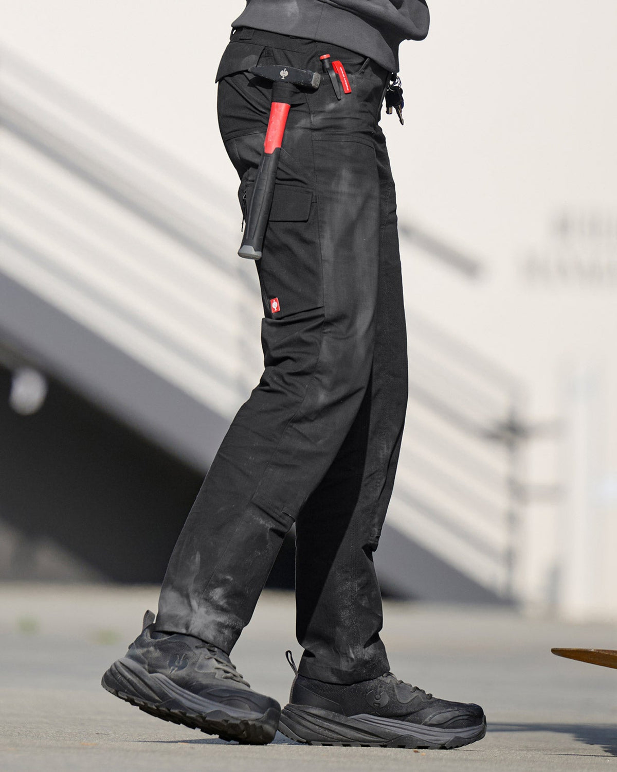 Lifestyle view of Women's Double Front Ripstop Cargo Work Pants e.s.e:pic in black during work