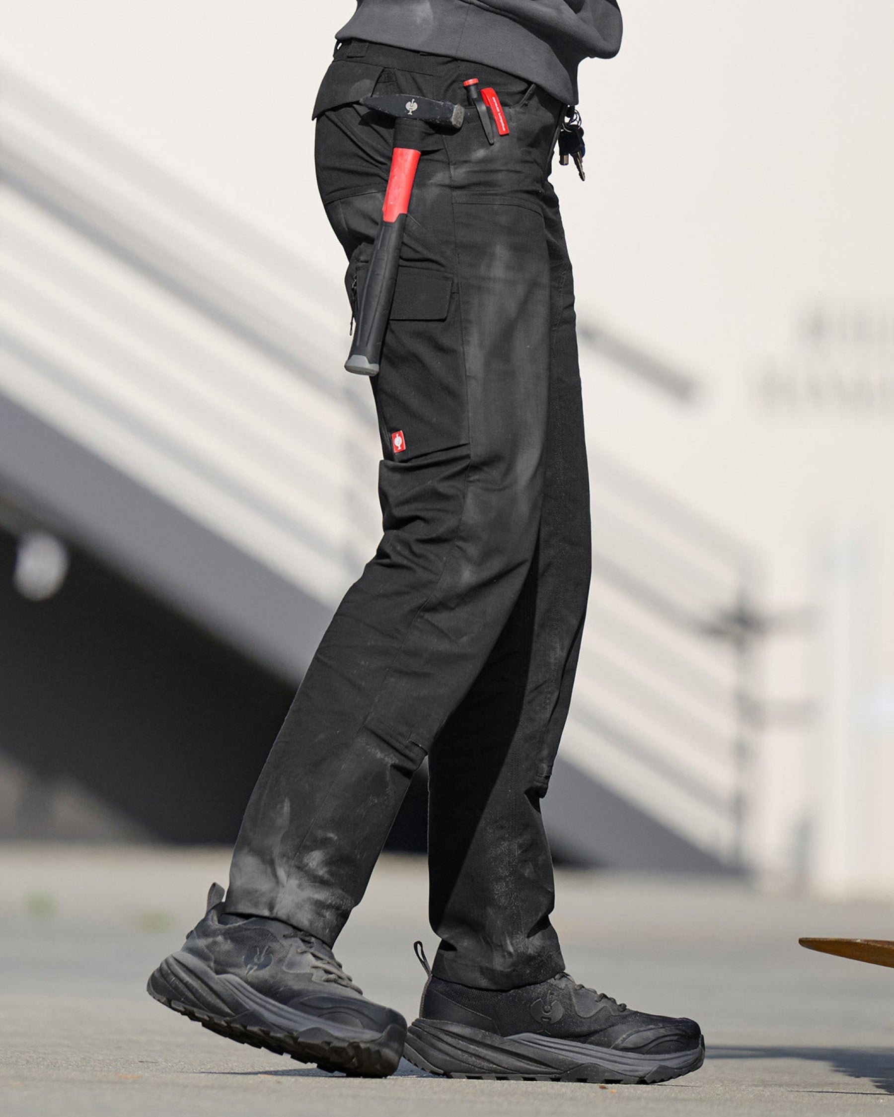 Lifestyle view of Women's Double Front Ripstop Cargo Work Pants e.s.e:pic in black during work