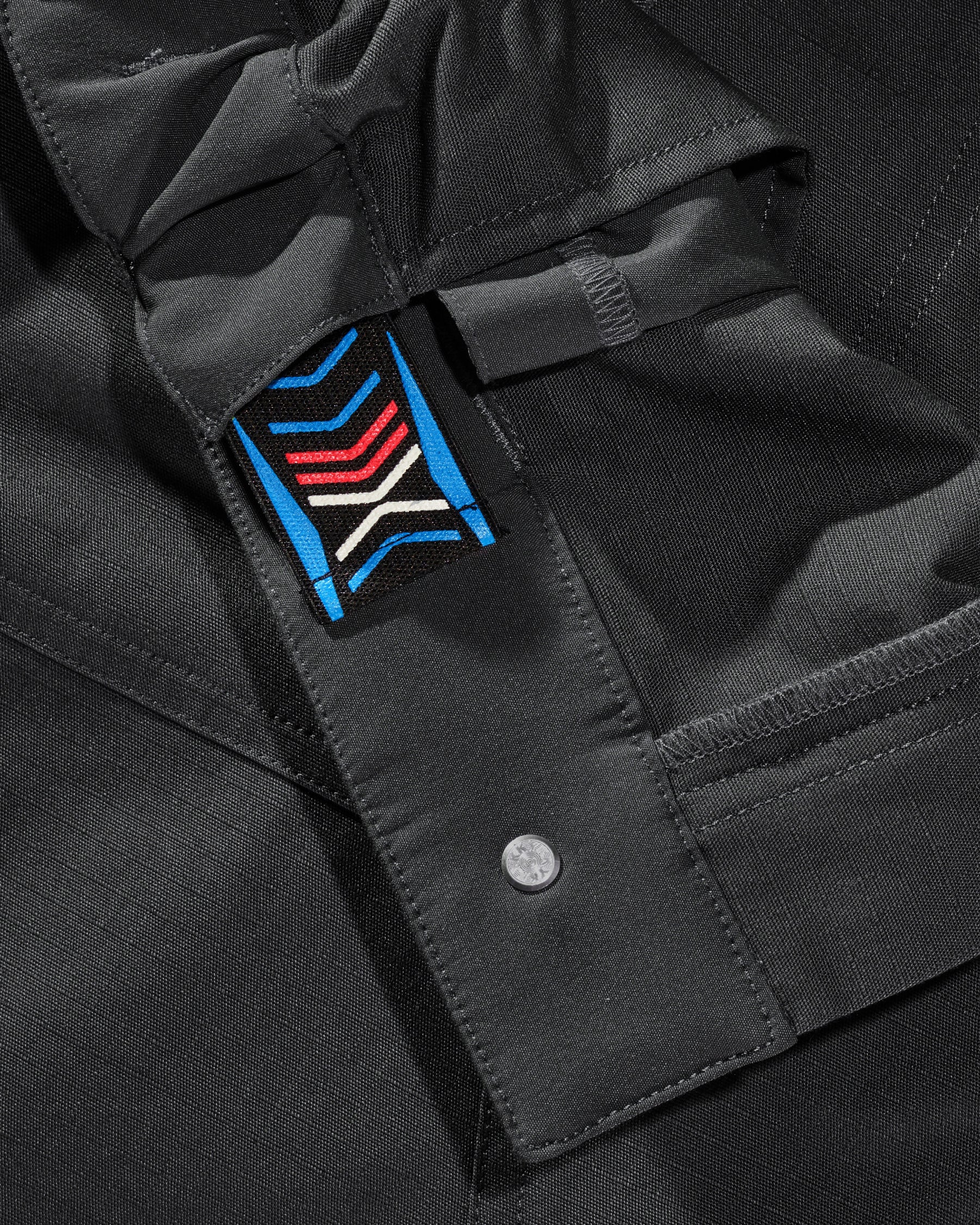 Close-up of cargo pocket details on Women's Double Front Ripstop Cargo Work Pants e.s.e:pic in black