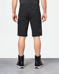 Alternate model view of Engelbert Strauss e.s. taktik stretch ripstop cargo work shorts in black, showing the side and back fit with visible utility pocket placement and workwear construction.
