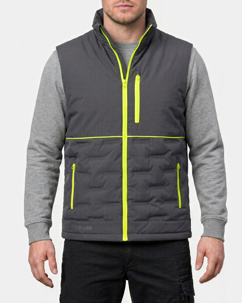 A man wearing a dark gray quilted zip-up vest over a heather gray long-sleeve shirt, with bright neon yellow-green trim details, against a light gray background.