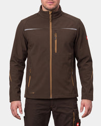 A man wearing a brown technical softshell jacket with tan zipper details and reflective chest stripes, paired with matching brown pants, against a light gray studio background.
