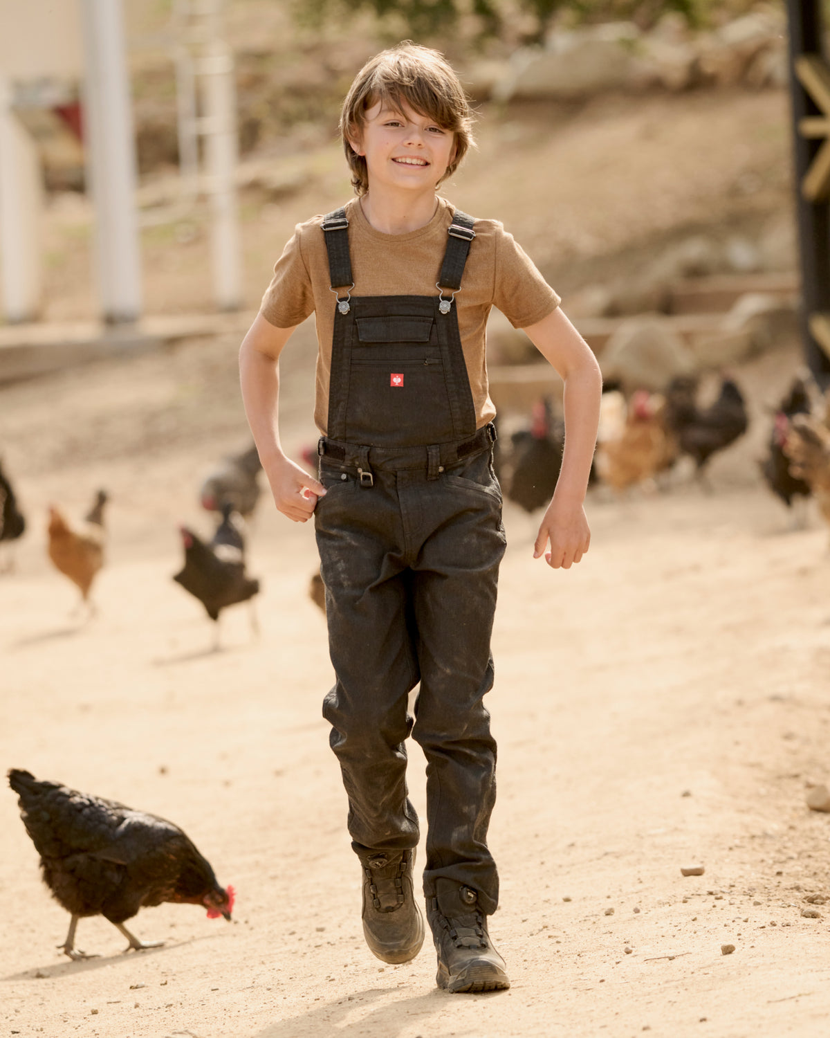 black STRAUSS Kids’ Multipocket Bib Overalls e.s.vintage worn in a work setting