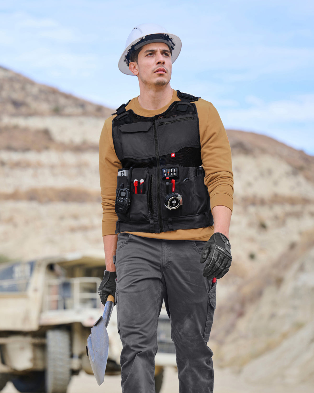 STRAUSS e.s.iconic tool vest in black shown during outdoor work