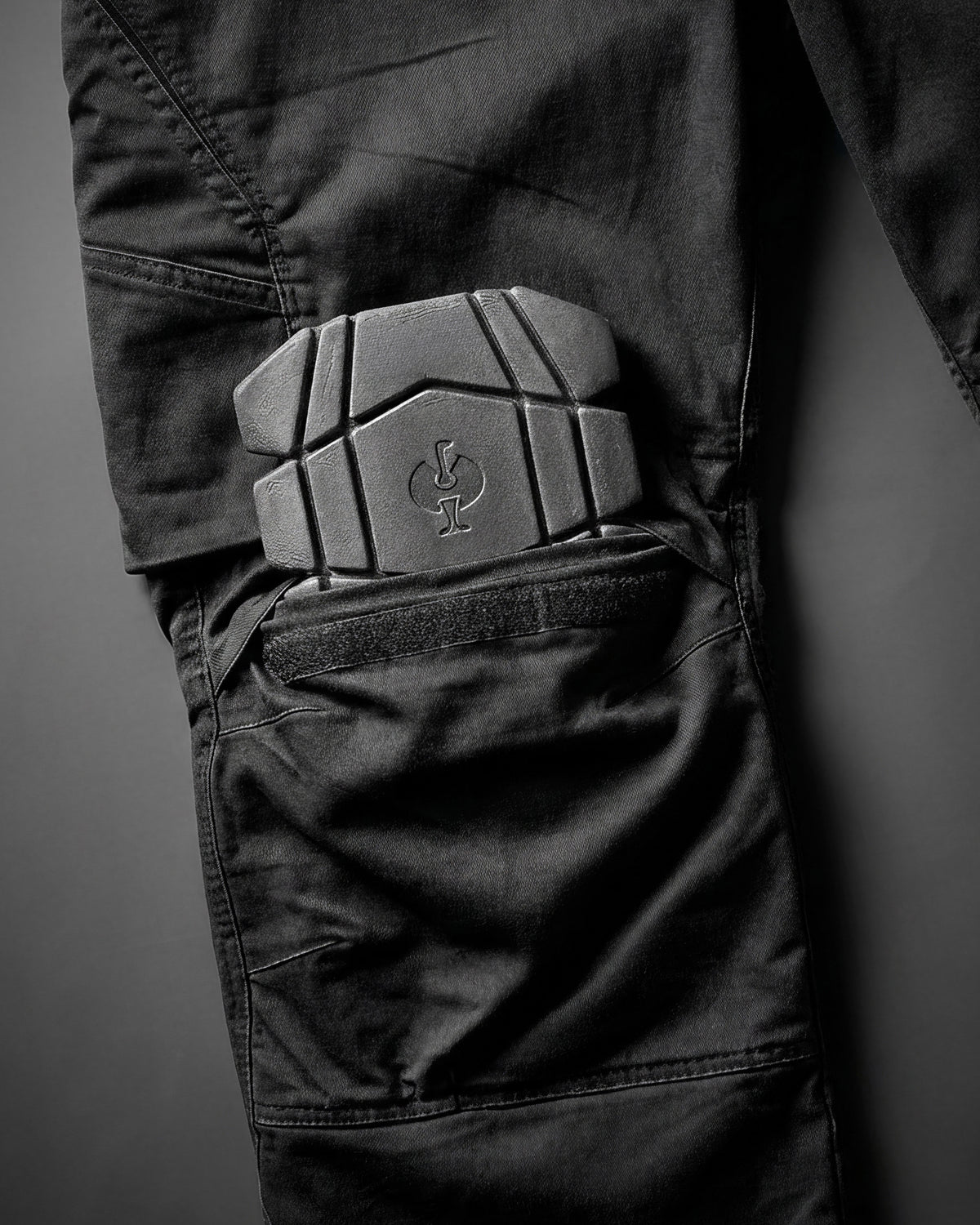 Close-up of the contoured cushioning and flexible shape on the graphite STRAUSS ergonomic knee pads.