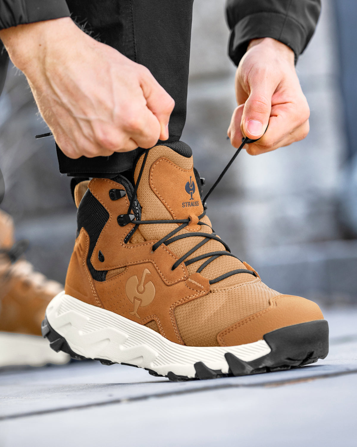 STRAUSS Rimini 6-inch Soft Toe Boot in Almond brown and Cream worn in an outdoor work setting