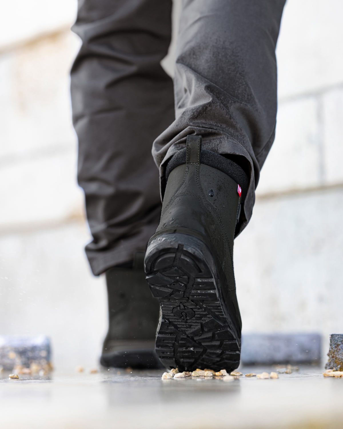 STRAUSS Woodside 6-inch Steel Toe Work Boot in Black worn in an outdoor work setting