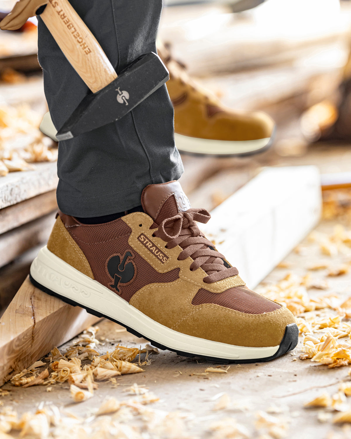 STRAUSS Canberra Steel Toe Work Shoe in Desert brown shown on rough jobsite ground