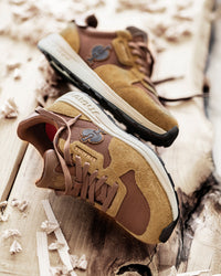 STRAUSS Canberra Steel Toe Work Shoe in Desert brown with workwear in a jobsite scene