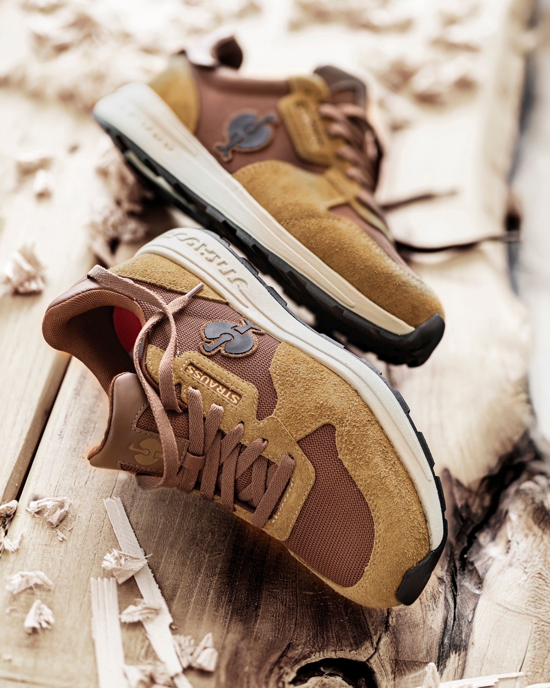 STRAUSS Canberra Steel Toe Work Shoe in Desert brown with workwear in a jobsite scene