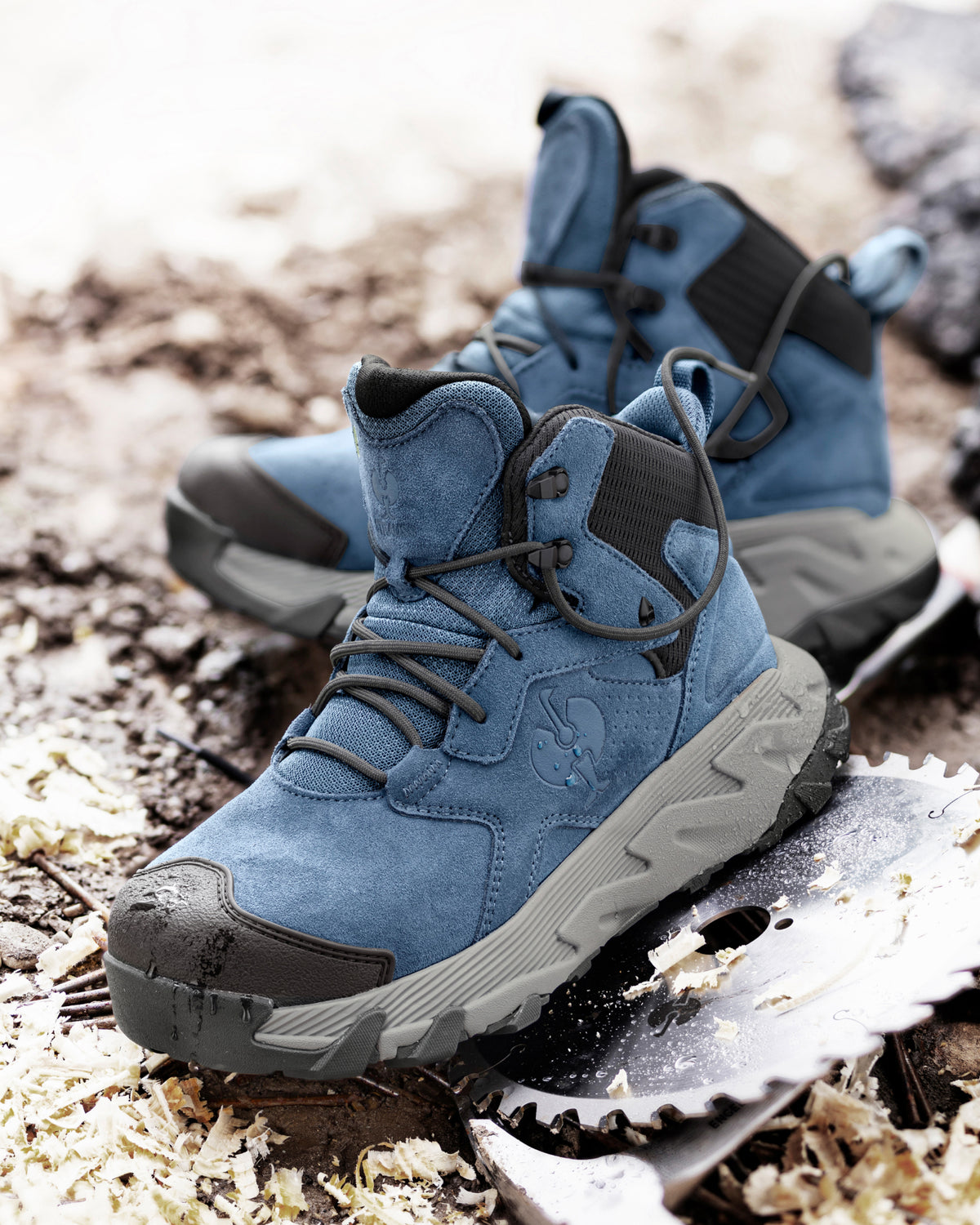 STRAUSS Turin 6-inch Aluminum Toe Work Boot in Oxid blue worn in an outdoor work setting