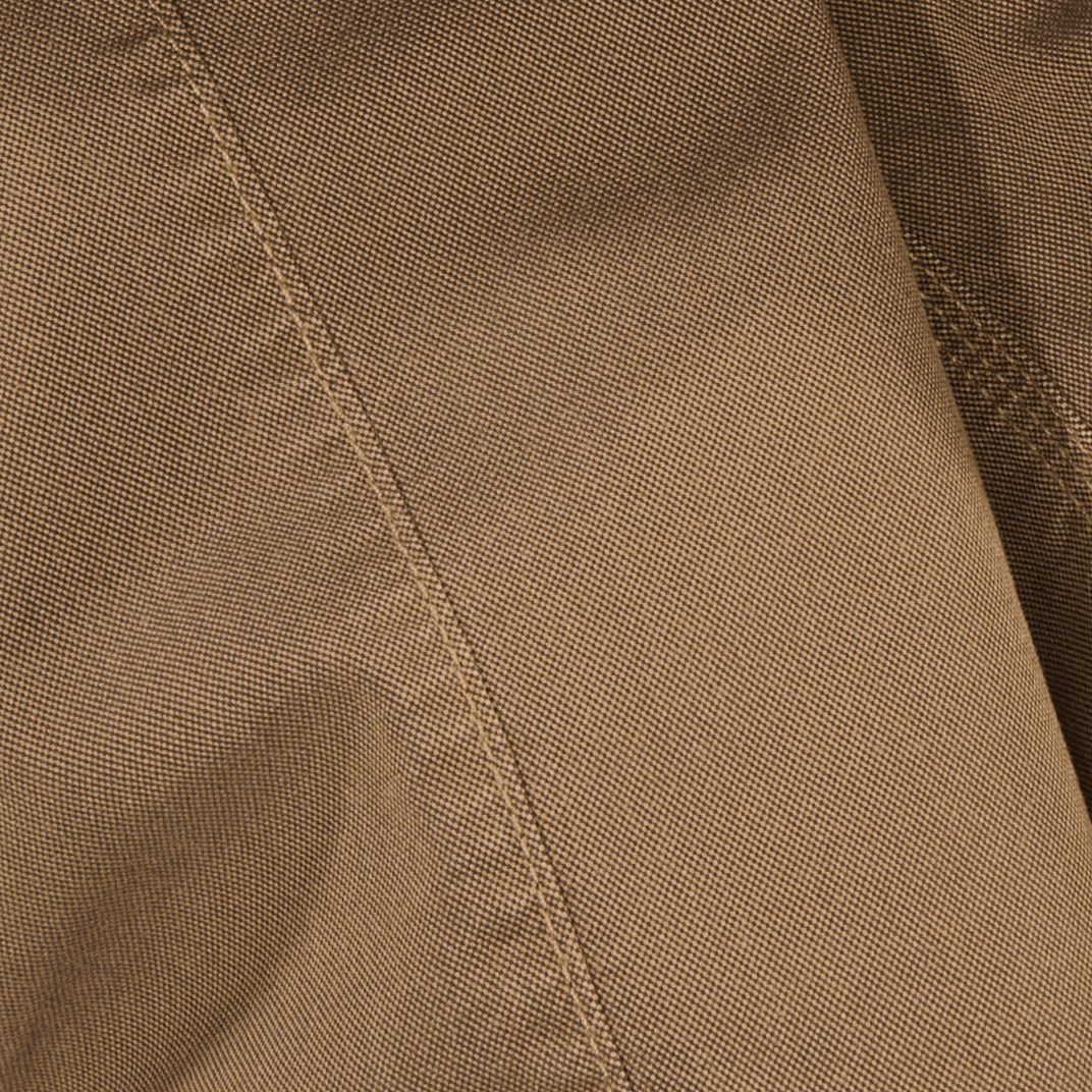 Close-up of brown canvas fabric with stitching detail