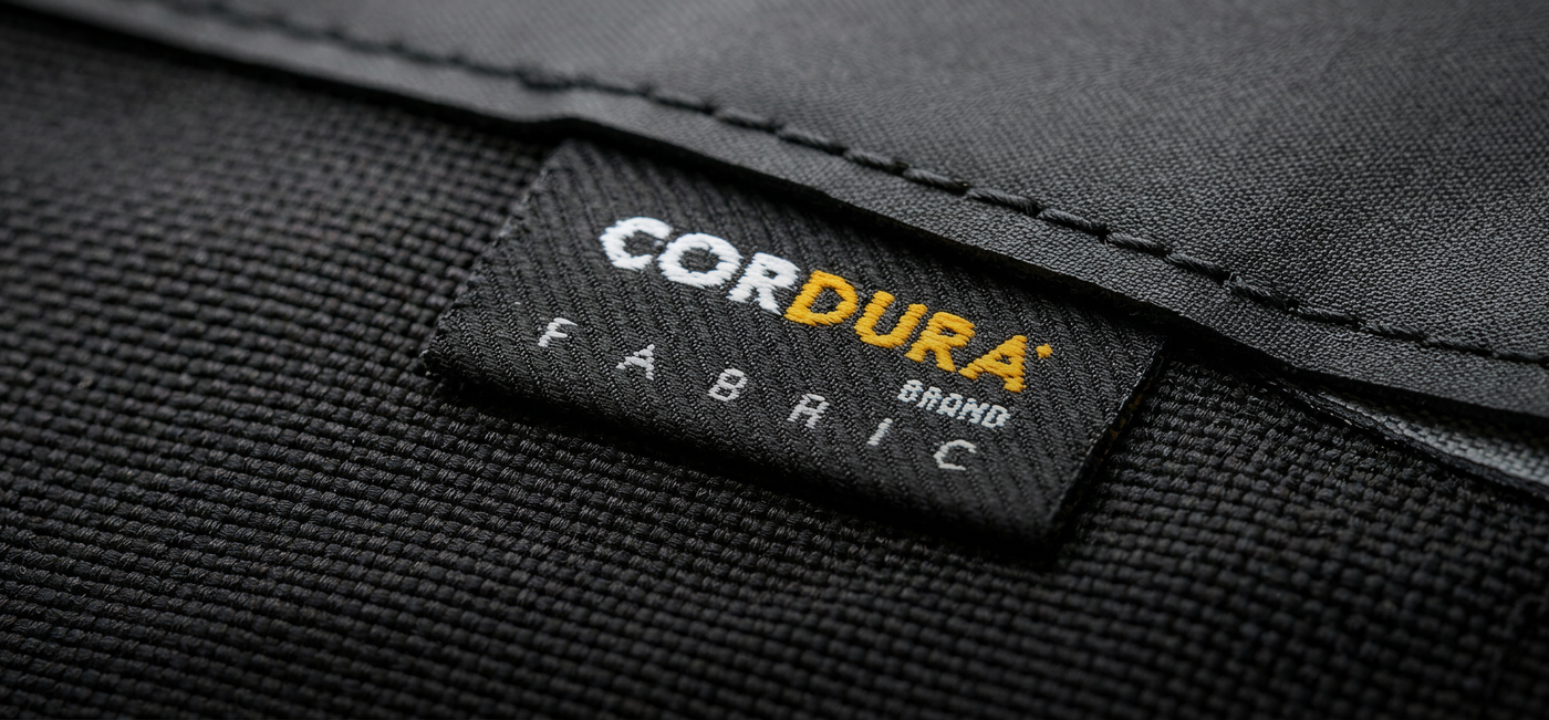 Close-up of a Cordura fabric label on black Cordura material