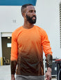 Man wearing an orange and black patterned long-sleeve shirt outdoors.
