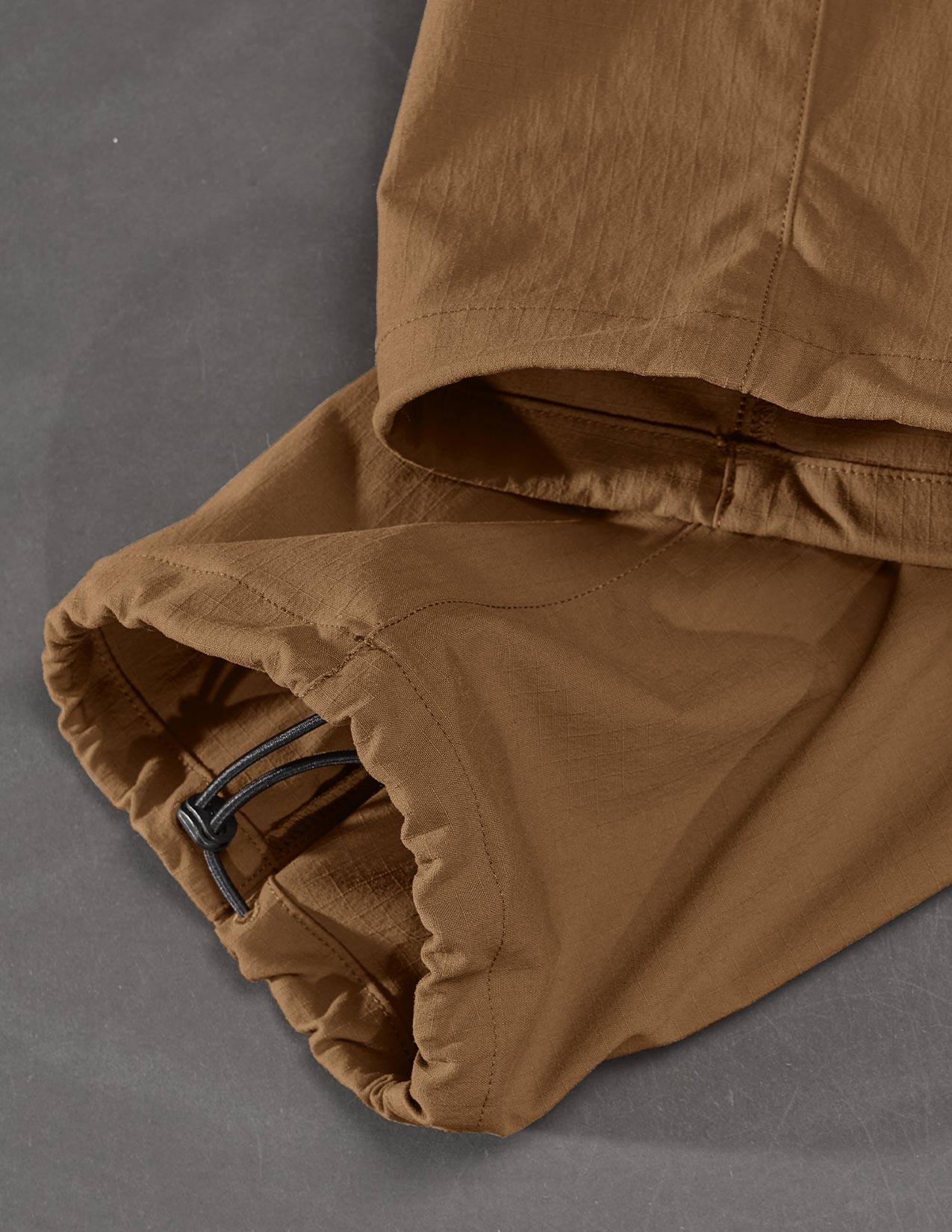 Brown pants with a zipper on a gray background