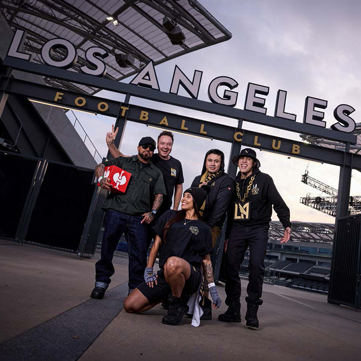Henning Strauss and other people with lafc wear in front of the LAFC Stadium