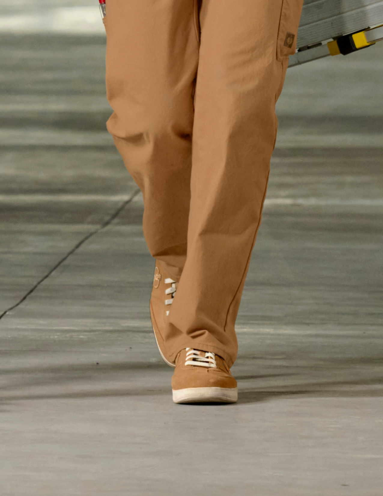 Person wearing brown pants and shoes.
